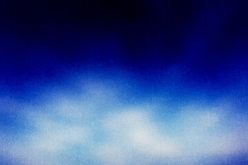 ざらざらの紙とぼやけた青空と白い雲の画像