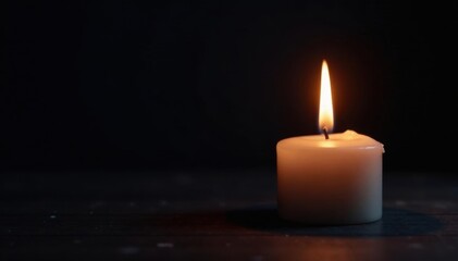 Single candle flame illuminates dark background, burning, heat, comfort