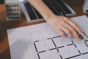 Discussion among businesspeople on the latest developments in solar cell panel technology and Solar...