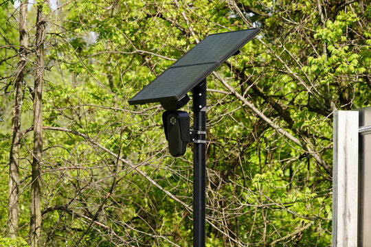 Flock safety police law enforcement license plate reader set up outside to help catch vehicle speeders.