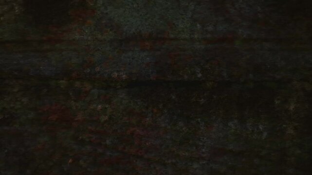 Bragan, County Monaghan, Ireland, September 2022. Drone top shot tracking right over dark backdrop background with single track road appearing between grass wetland bog.