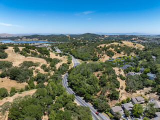 Aerial views of the San Marin neighborhood and surrounding hills in Marin County, California. Suburban homes, winding roads, and oak-dotted golden hills define the scenic North Bay landscape.
