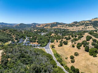 Aerial views of the San Marin neighborhood and surrounding hills in Marin County, California. Suburban homes, winding roads, and oak-dotted golden hills define the scenic North Bay landscape.