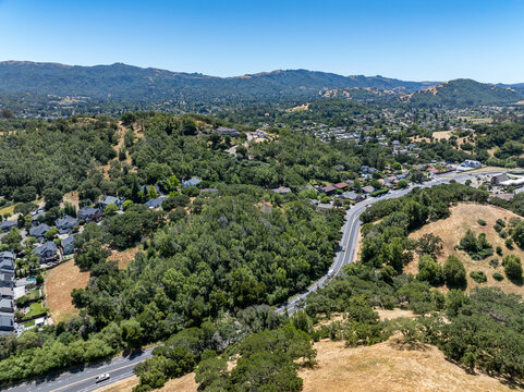 Aerial views of the San Marin neighborhood and surrounding hills in Marin County, California. Suburban homes, winding roads, and oak-dotted golden hills define the scenic North Bay landscape.
