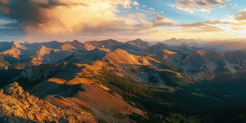 Naklejka premium A wide-angle view of colorful striated mountains glowing in the golden hour light