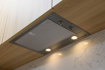 A clean range hood in the kitchen.