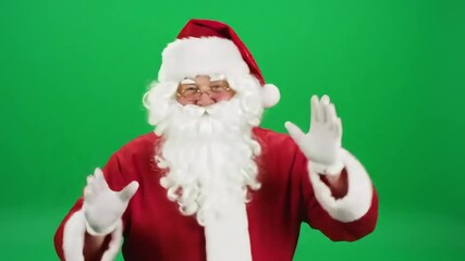 Cheerful Santa Claus in red suit and hat, isolated on green screen chroma key background. Funny dancing, joyful expression, festive holiday vibe, perfect for Christmas and New Year scenes.

