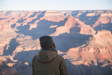 Female tourist enjoying the view of Grand Canyon in Arizona, USA