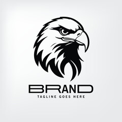 Obraz premium Black and white stylized eagle head logo design in a minimalist graphic style. Powerful image of an eagle head profile view, ideal for a branding or company logo.