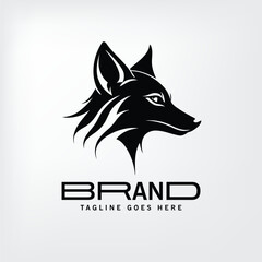 Fototapeta premium Black and white stylized fox head logo design in profile view. Modern logo design for a business or brand with a nature-inspired aesthetic.