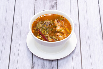 Tom Yum Chicken with young tamarind leaves, spicy and sour