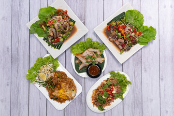Charcoal-boiled Pork Neck with the Sauce is Spicy Sour Taste is a Popular Appetizer in Thailand.