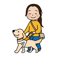 たれ耳の盲導犬と歩く女性