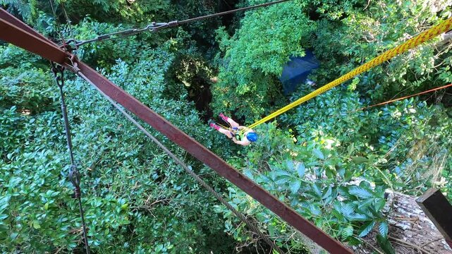 Climbing a rope to a jungle treehouse, Manzanillo, Costa Rica