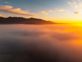 Sunset over Liptov region with and High Tatras mountains around. Liptovsky Mikulas landspace, slovakia.