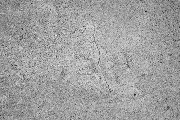 Rough gray concrete texture background with natural grain pattern and subtle surface cracks