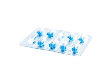 White and blue medical pills in transparent blister pack isolated on white background, Medical pills capsule