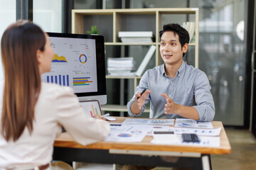Financial Business Team analyze the graph of the company's performance to create profits and...