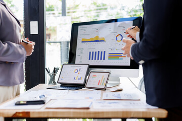 Financial Business Team analyze the graph of the company's performance to create profits and...