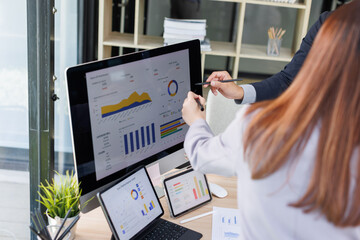 Financial Business Team analyze the graph of the company's performance to create profits and...