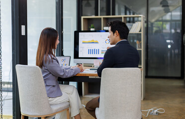 Financial Business team analyze the graph of the company's performance to create profits and...
