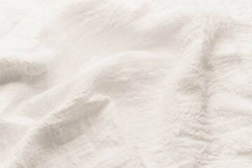  White wrinkled linen fabric texture background close up