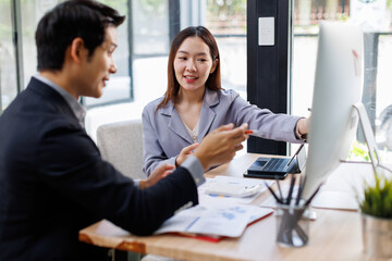 Asian business Team working at office with documents on his desk, doing planning analyzing the financial report, business plan investment, finance analysis concept	