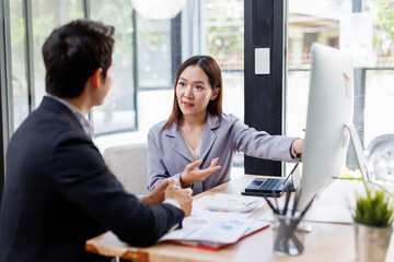 Asian business Team working at office with documents on his desk, doing planning analyzing the...