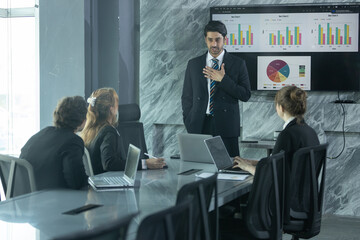 Business Presentation in a Modern Conference Room With a Diverse Team Discussing Data Analytics