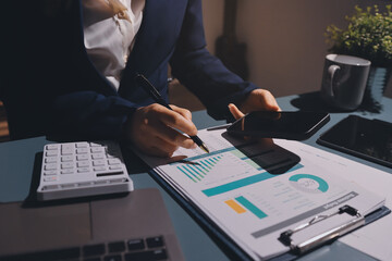 Expert woman asian female people review data number costing managerial account prepare monthly...