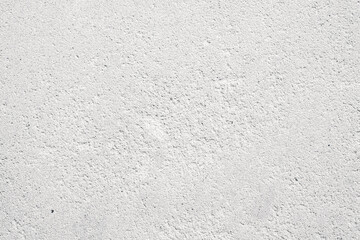 Smooth white surface with subtle texture in bright lighting