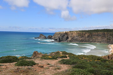 View of the steep cliffs at Odeceixe beach, Algarve, Portugal