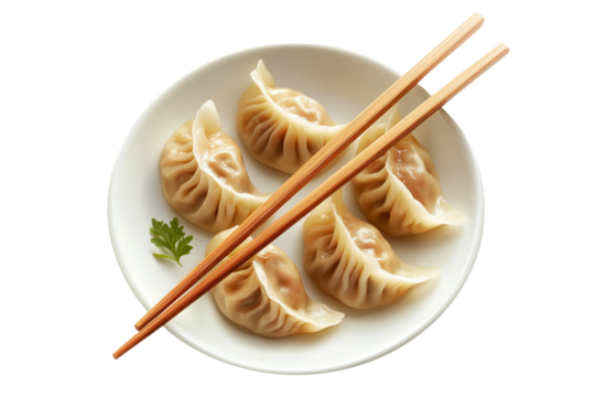 Steamed mandu dumplings placed on ceramic plate with chopstick, isolated on white transparent background, concept of Asian cuisine