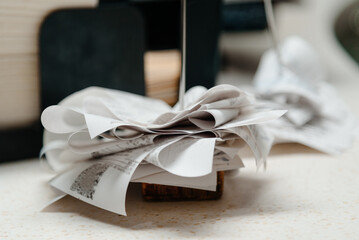 pile of spiked papers, restaurant and bar checks with orders on bar counter