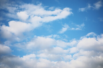 Serene Blue Sky with Fluffy White Clouds on a Clear Sunny Day