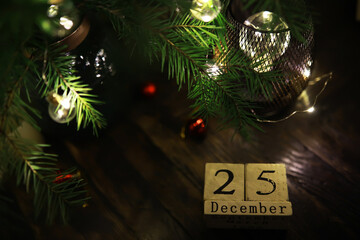 Festive Christmas Setting with December 25 Calendar Block and Holiday Lights