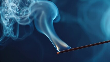 smoldering incense stick, wisps of pale blue smoke spiraling against a deep navy background in smooth, hypnotic flow. - Powered by Adobe