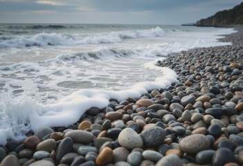 Obraz premium Foamy surf washing over a mosaic pattern of tide-pool stones