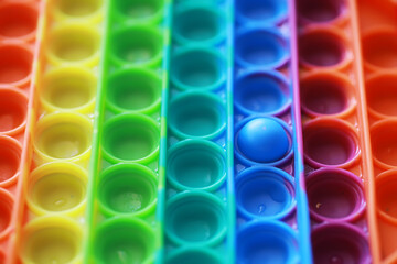 Colorful Pop It Fidget Toy Close-Up with Vibrant Rainbow Pattern