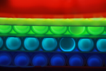 Colorful Abstract Background with Gradient Layers of Red, Green, and Blue Neon Lights