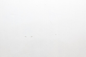 A white wall with a white paint splatter on it
