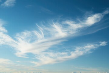 Fototapeta premium Blue sky with feathery white clouds in the daytime