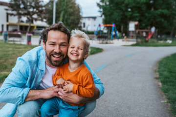 Fototapeta na wymiar Portrait of dad and child enjoying time together