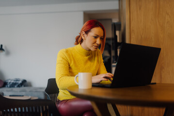 Focused freelancer working remotely from home office