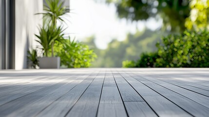 A close up of a wooden deck with plants in the background on a sunny day creating a peaceful scene