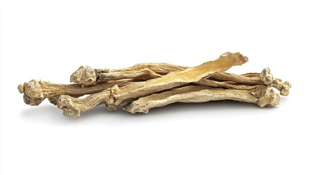A close up of a pile of dried codonopsis pilosula roots on a white surface in a studio setting