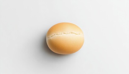 Fresh Baked Dinner Roll on White Background Showing its Golden Crust and Doughy Texture Overhead Shot