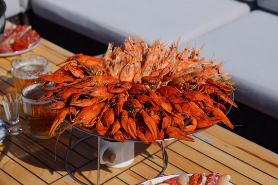 Seafood platter overflowing with prawns on a wooden table