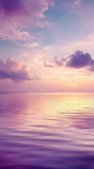 Pastel Sunset Over Ocean Horizon with Soft Clouds and Glowing Water Reflection