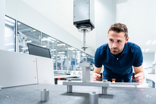 Engineer inspecting machinery in an industrial setting